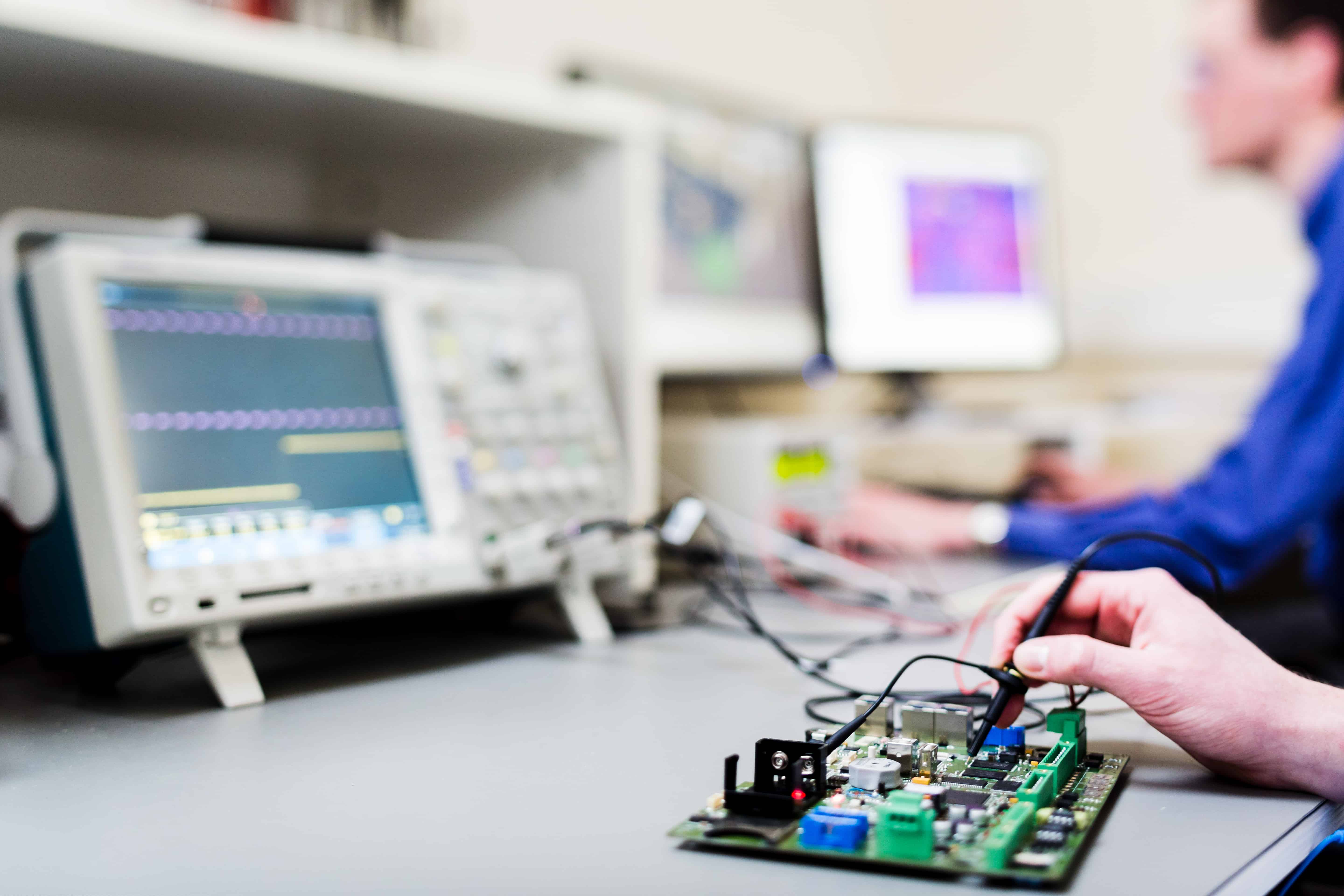 Hardware validation — oscilloscope testing at Thelis lab